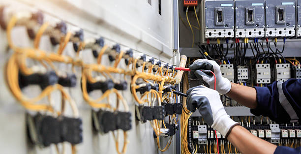 Professional Electrician technician working in Island Park, NY